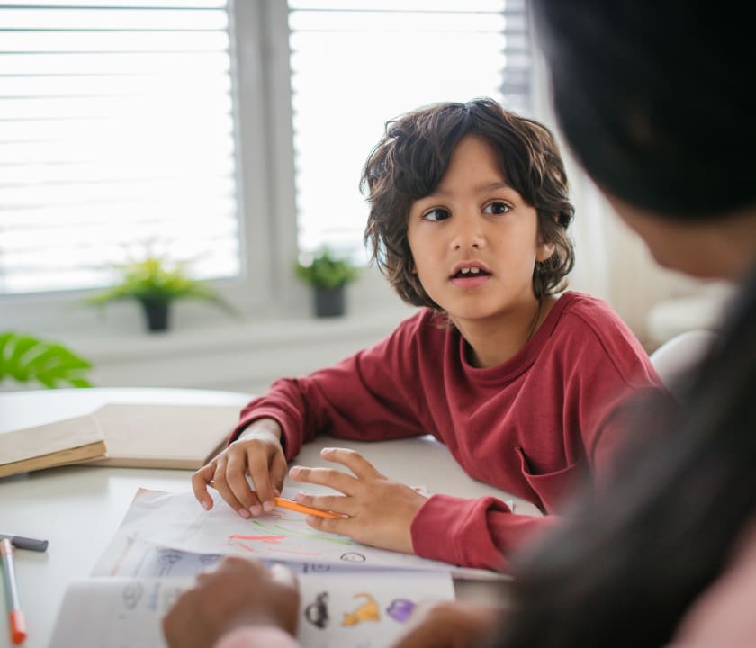 Parent supporting a child learning at home
