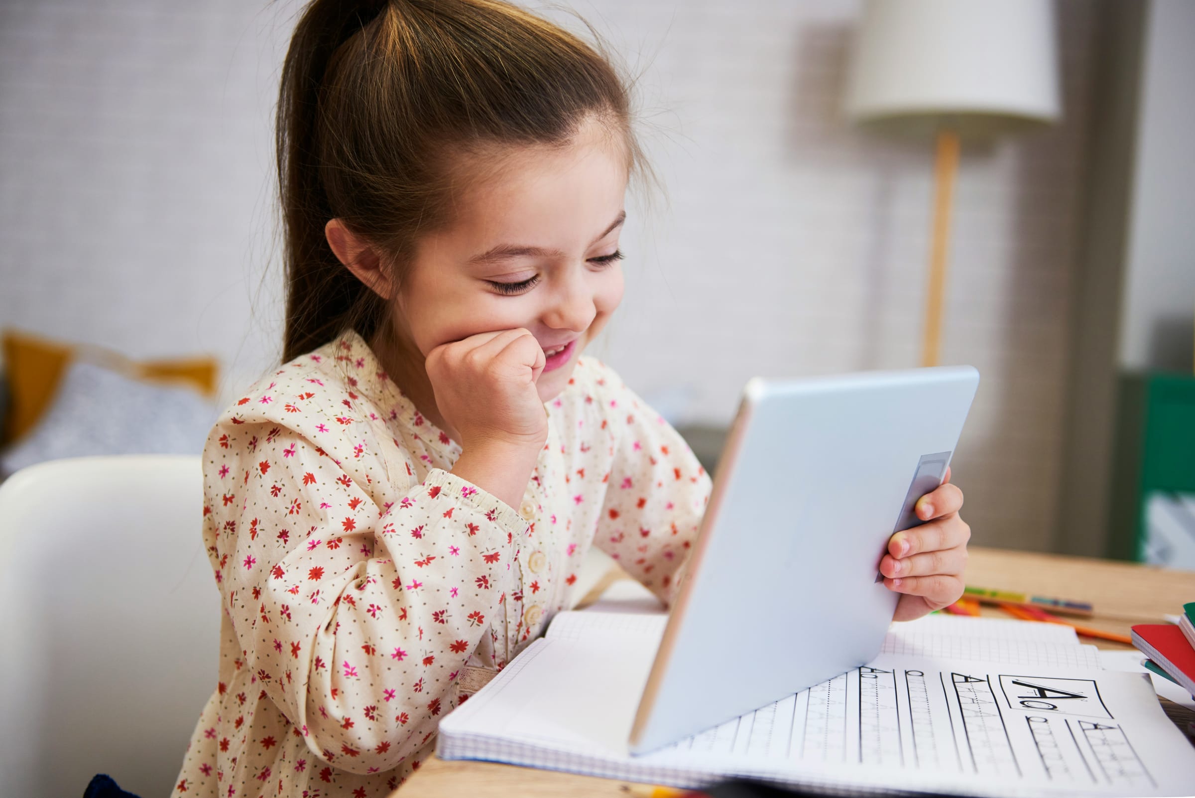Printable worksheet preview beside a laptop